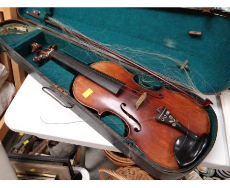 A vintage cased Maggini German made violin dated 1886