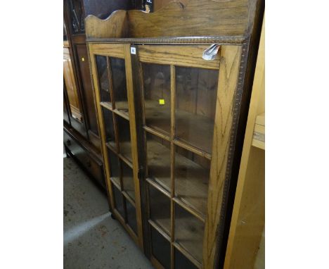 A good vintage oak two glass door bookcase with railback shelf top