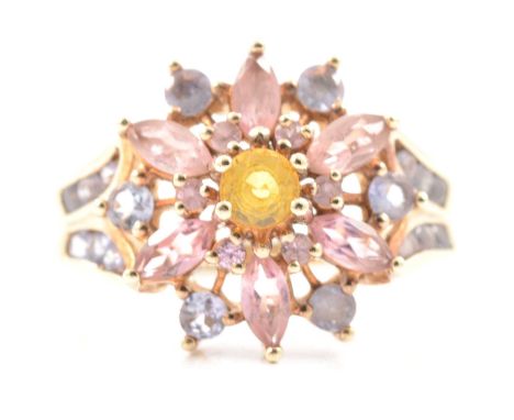 A multi gemstone cluster ring, a central 4mm yellow sapphire surrounded by six 1.5mm pink sapphires and bordered by six marqu