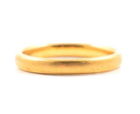 A 22 carat yellow gold wedding band, 3mm wide plain polished D shape, Birmingham 1936, ring size N, 4.7g.