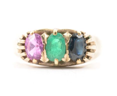 A gemstone set ring, claw set with an oval mixed cut emerald, sapphire and pink sapphire, approximately 5.5x4mm, unmarked all