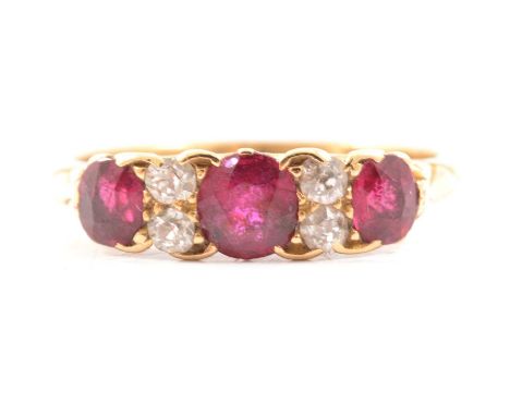 A Victorian ruby and diamond half hoop ring, the three oval rubies spaced by two pairs of old cut diamonds claw set in an 18 