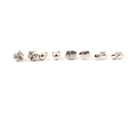 A pair of white metal ball stud earrings, approx. 6mm diameter, marked 375; a pair of white metal knot design stud earrings, 