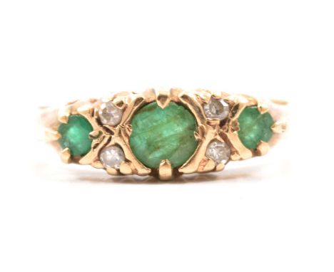 A reproduction Victorian style emerald and diamond half hoop ring, three circular emeralds spaced by two pairs of eight-cut d