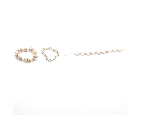 Three silver bracelets, a solid 11mm gauge oval link chain bracelet hallmarked London 2014; a "Silver" bracelet formed from n