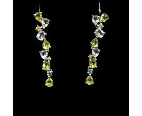 A pair of aquamarine and peridot drop earrings, oval and pear shaped faceted stones set in 9 carat white gold, pierced fittin