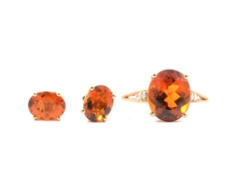 Gemporia - A Santa Ana citrine and diamond ring, the oval cut citrine (4.540 carats) claw set, with two small round diamonds 