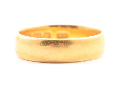 A 22 carat yellow gold wedding band, 5mm wide plain polished D shape, ring size O, hallmarked Birmingham 1903, 5.9g, sold wit