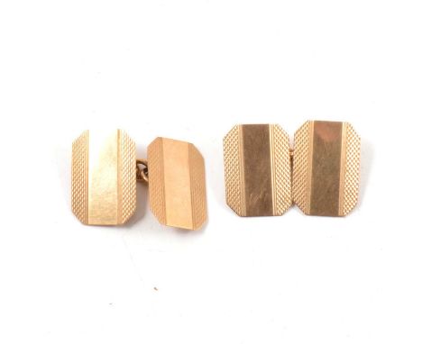 A pair of 9 carat yellow gold chain link cufflinks, the rectangular links with canted corner having engine turned faces, Birm