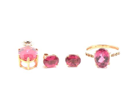 Gemporia - A Cruzeiro rubellite and red diamond ring, the oval cut rubellite (2.74 carats) claw set, with three small red dia