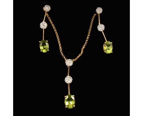 A peridot and diamond pendant and earring suite, the pendant set with an oval mixed cut peridot 7.5x5.5mm, four claw set in 1
