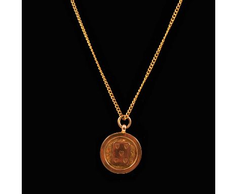 A 9 carat yellow gold pendant, 23mm circular disc with five of hearts card to centre, presentation engraved back dated 1924-2