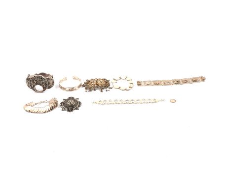 A collection of silver and white metal jewellery testing as silver, a six panel bracelet depicting Greek scenes, marked 925; 