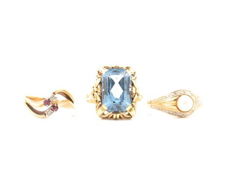 Three gemset dress rings, a rectangular synthetic blue spinel four claw set in a yellow metal mount, 585 stamped on shank, ri