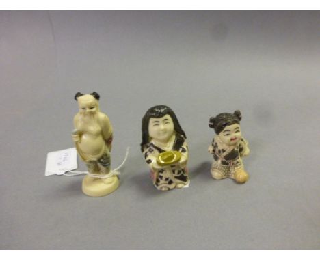 Three netsuke style carvings to include Lady with gold