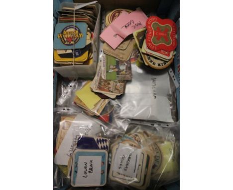 A collection of vintage beer mats 