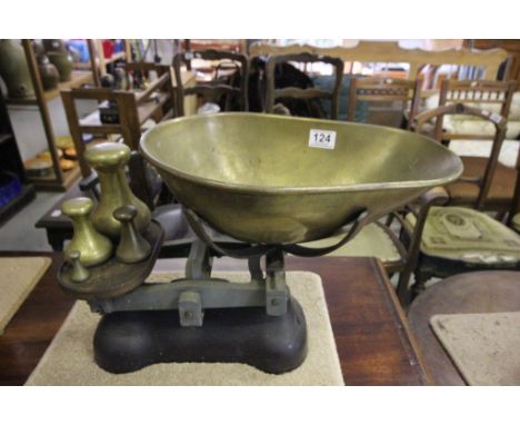 A large set of vintage scales, along with four weights 