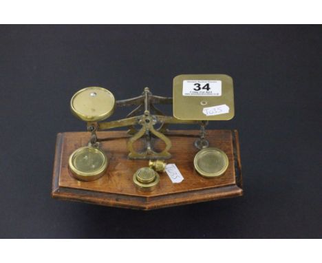 Early 20th century Brass Postal Scales and Weights on Oak Base