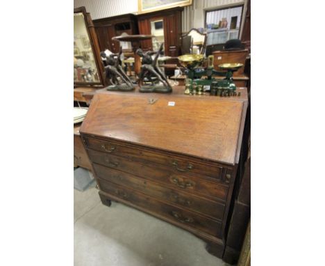 Large Early 19th century Mahogany Bureau, the hinged front revealing fitted interior above four long drawers on bracket feet