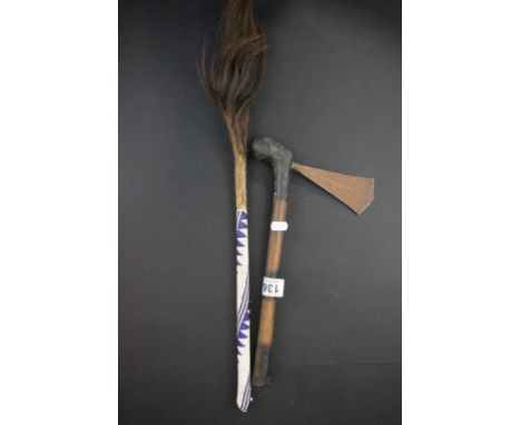 A trial axe with a beaded handle, along with a fly swish 