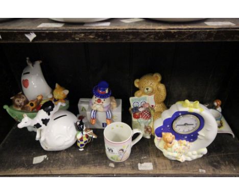 A collection of 7 pieces of Aynsley Nursery Rhyme items to include money boxes, clock, mug and egg holder 