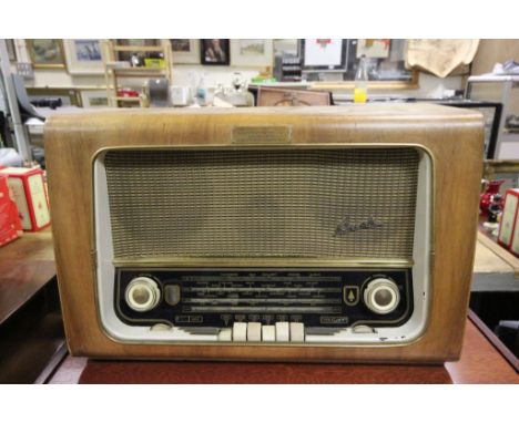 A vintage walnut cased radio by Bush