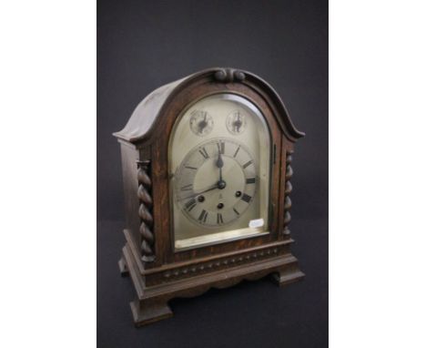 A 20th century oak cased mantel clock with an eight day movement 