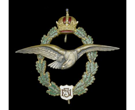 An Austrian Great War Pilot’s Badge. A superb example in silver-gilt and enamel, the lower plaque with the scroll FJI (Empero