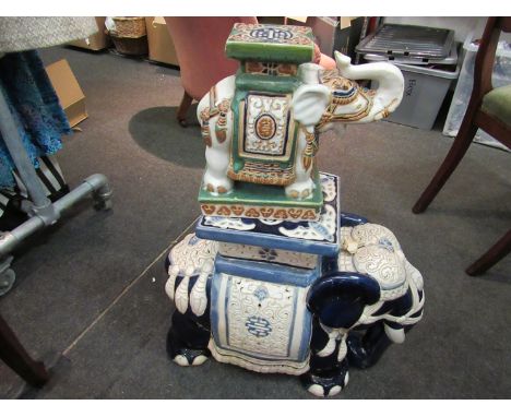 Two ceramic elephant jardiniere stands