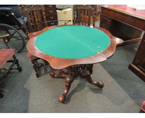 Circa 1840 a figured walnut serpentine front, hinged swivel top card table over a turned and melon fluted carved column with 