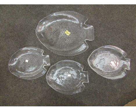 A French seven piece glass plate set with serving platter of fish form made by Arcoroc France, boxed and a studio art glass b