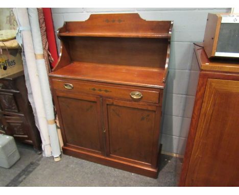 A Regency style mahogany chiffonier with raised shelf back and holly inlaid decoration the single drawer over a two door cupb