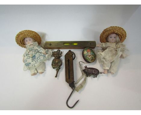 Two novelty tape measures, spirit level, pocket balance scale and imp door knocker etc.