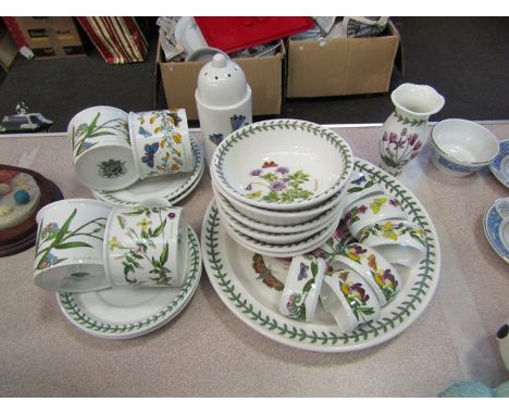 A collection of Portmeirion Botanic garden table wares including six bowls, six napkin rings, sugar shaker, four cups and sau