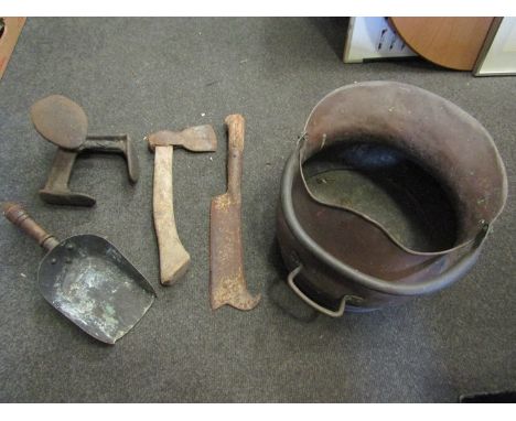 A coal scuttle, flat irons, stones and tools, etc