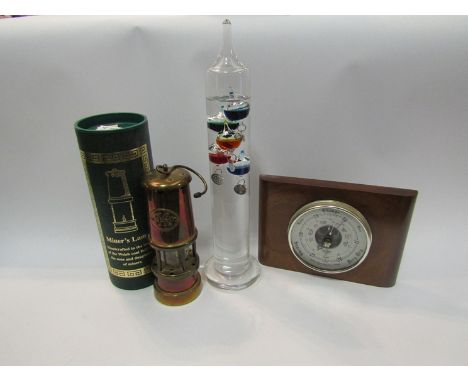 A miniature sextant, barometer, miners lamp and Galileo thermometer