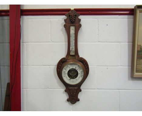An early 20th Century aneroid barometer with presentation plaque