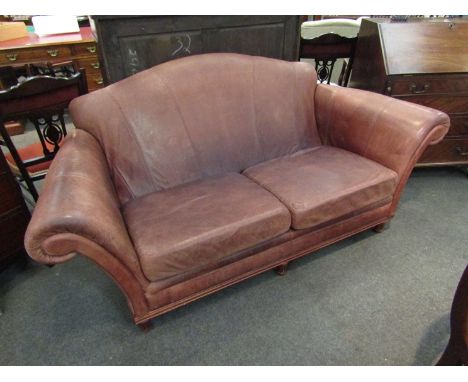 A brown leather two seater sofa, 195cm wide x 92cm tall