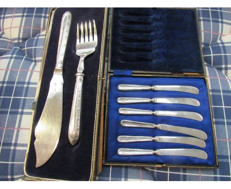 A white metal fish knife and fork set, cased a/f and a set of six butter knives, EPNS blades with silver handles marked Sheff