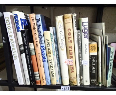 Shelf of books on firearms etc 