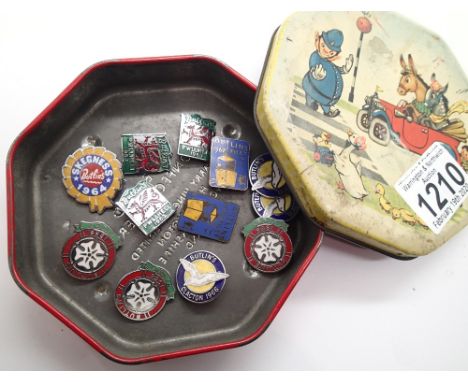 Vintage Toy Town tin containing twelve enamelled Butlins collectable badges 