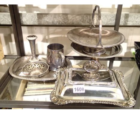 Shelf of silver plated items 