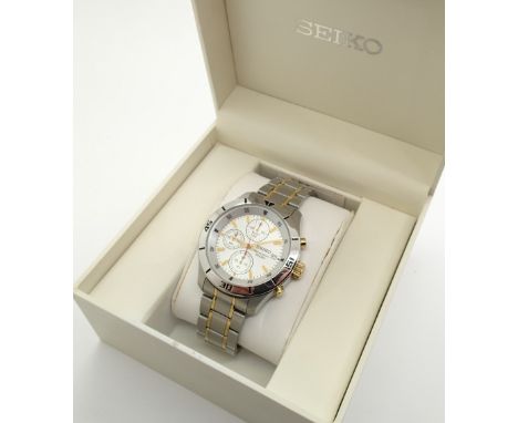 Vintage Seiko chronograph wristwatch on a stainless steel and gold tone bracelet water resistant to 100m with silver dial and