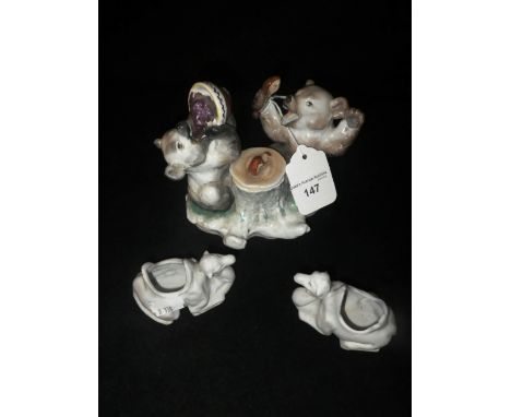 A CONTINENTAL CERAMIC ORNAMENT in the form of two bears and two similar camel ornaments