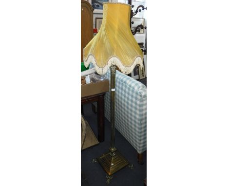 A BRASS CORINTHIAN COLUMN STANDARD LAMP