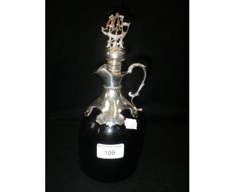 A 'BRISTOL' BLUE GLASS BRANDY DECANTER with engraved scroll decoration and galleon topped stopper