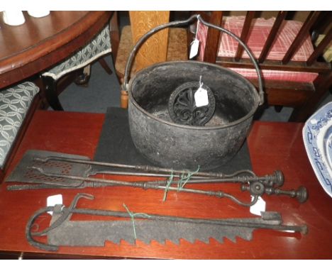 AN 18TH CENTURY IRON POT-JACK,  a set of three Victorian fire tools, an iron cooking pot and a trivet