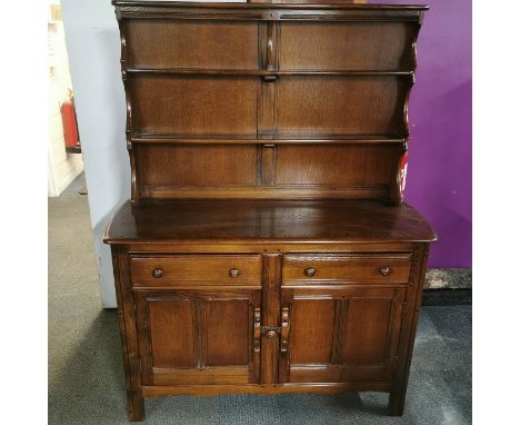 An Ercol two drawer elm Welsh dresser, 160 x 124 x 47cm.