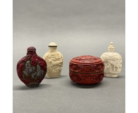 A Chinese carved cinnabar box, dia 7cm H. 5cm. Together with three interesting snuff bottles.