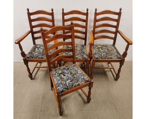A set of four ladderback dining chairs with floral upholstery, H. 98cm. Possibly Ercol.